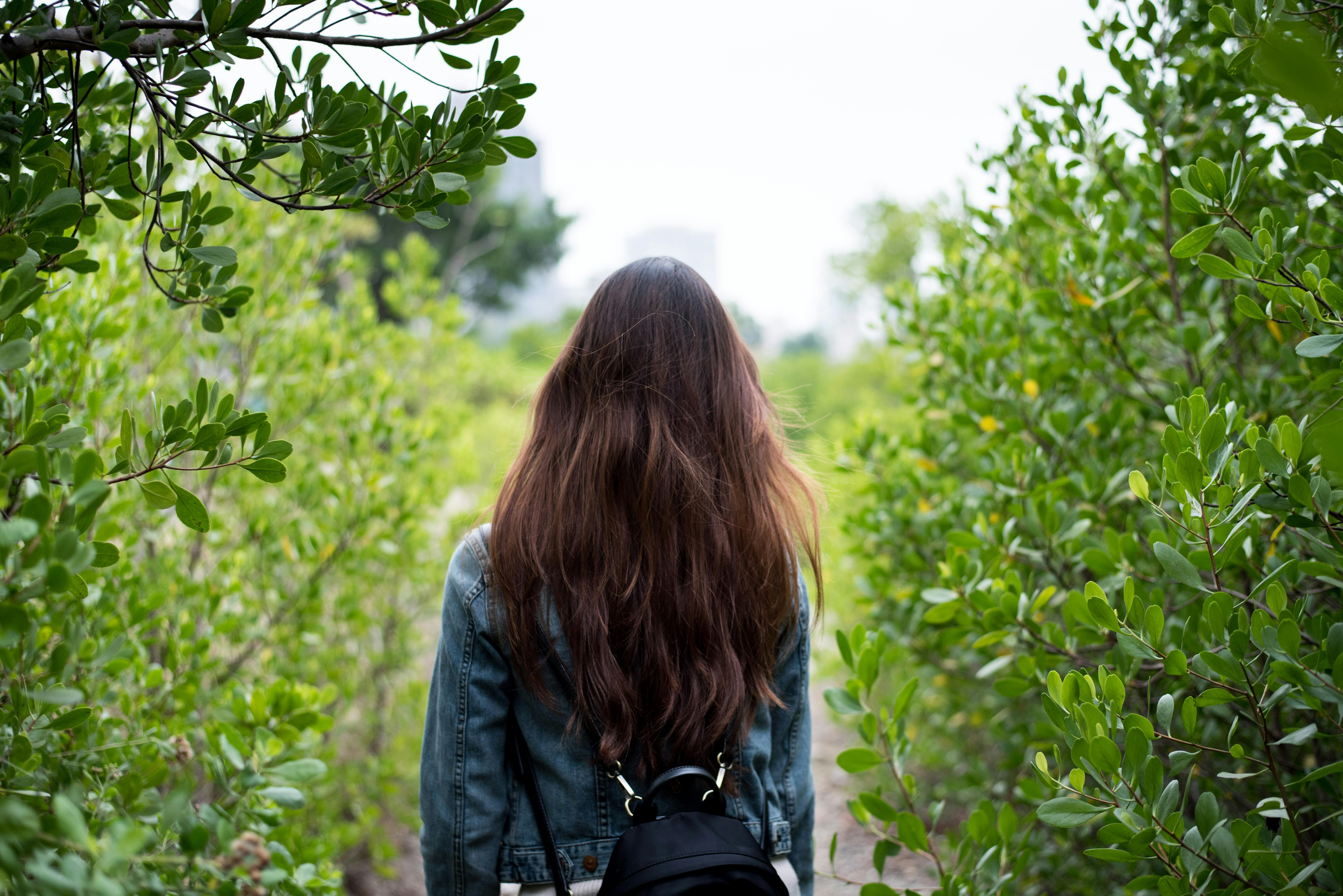 a woman walking in nature